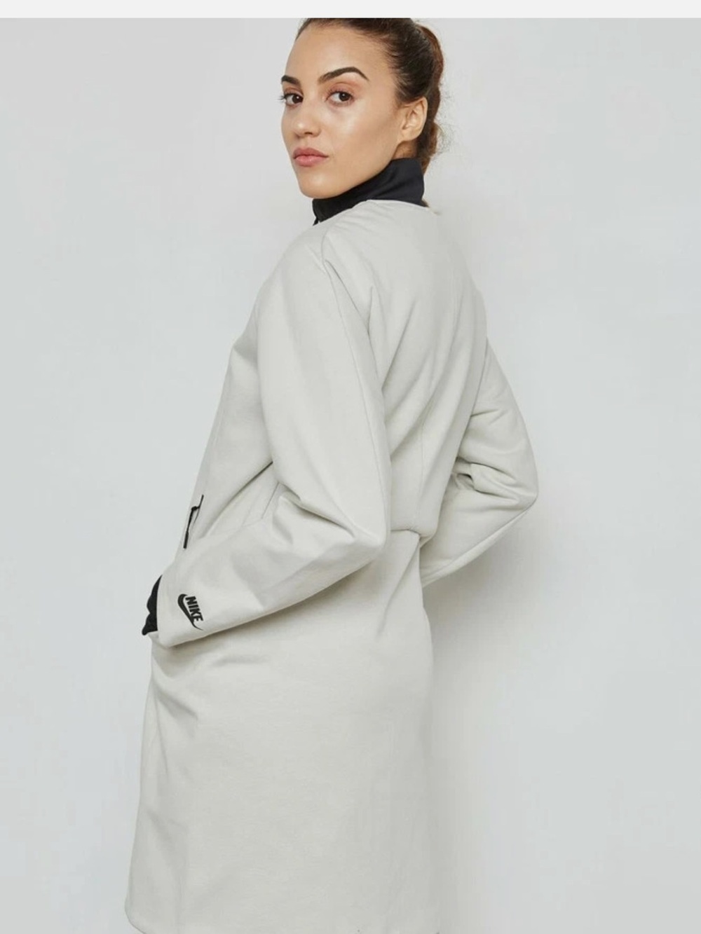 Nike Women's Sportswear Tech Cream-White Long Zip Trench Coat with Black Accent.